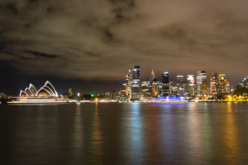 Night time landscape view of Sydney Australia, harbour and CBD - long exposure reflections