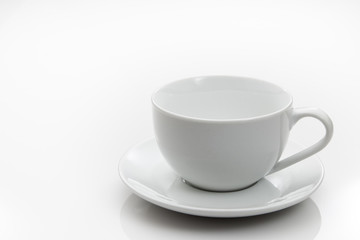 White cup and saucer on white background.