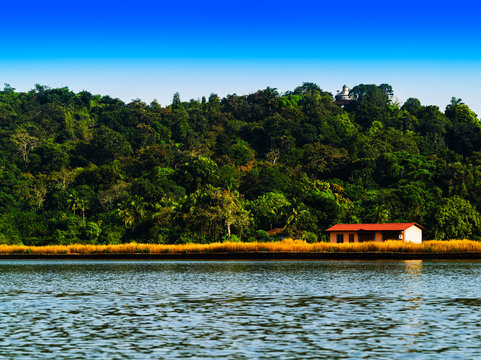 Horizontal vivid right aligned indian house on river landscape b