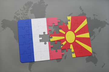 puzzle with the national flag of france and macedonia on a world map background.