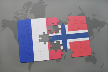 puzzle with the national flag of france and norway on a world map background.
