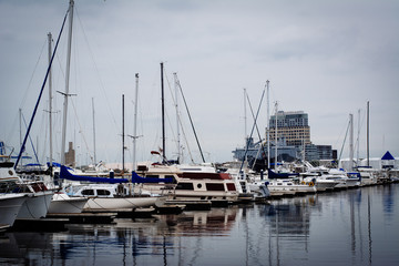 Fototapeta na wymiar Boats docked in a marina in Canton, Baltimore, Maryland.