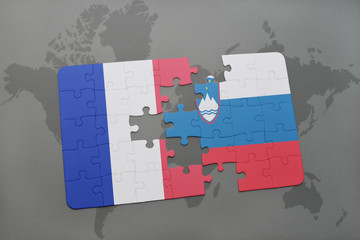 puzzle with the national flag of france and slovenia on a world map background.