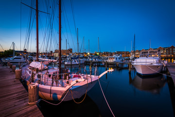 Boats in a marina at twilight, in Fells Point, Baltimore, Maryla