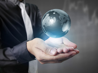 earth in human hand, hand holding our planet earth glowing