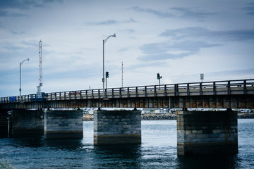 Fototapeta na wymiar Bridge over Hampton Harbor Inlet in Hampton Beach, New Hampshire