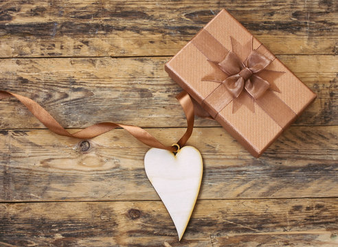 plywood heart on silk ribbon and gift box