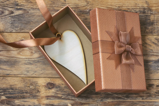 heart on silk ribbon is inside gift box