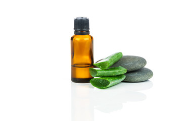 Sliced aloe leaves with bottle extract isolated on white background