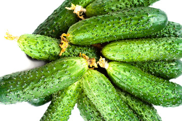 ..Heap of Fresh Cucumber isolated over white background close up