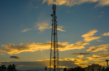 cell phone tower in sunset.