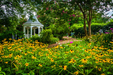 Colorful garden and gazebo in a park in Alexandria, Virginia.