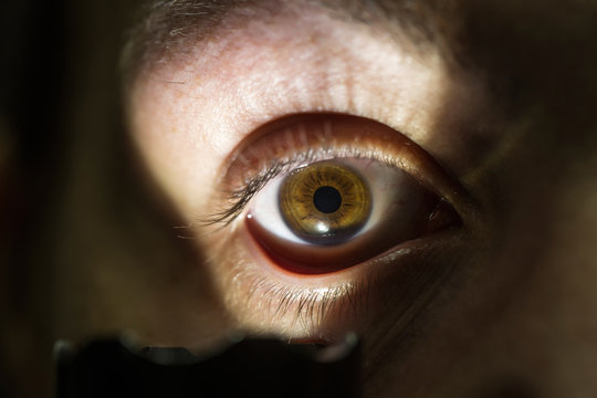 male eye with flashlight