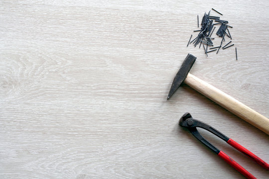 Carpenter tools with wooden background. Top view with copy space