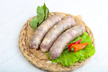 Raw sausages for cooking