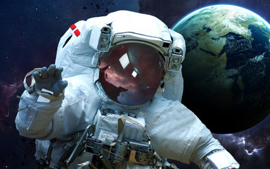 Astronaut in outer space. Spacewalk. Elements of this image furnished by NASA