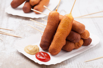 Corn dog. Sausage baked in corn dough. © gkrphoto