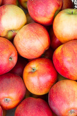 Tasty ripe apples in the market on the counter