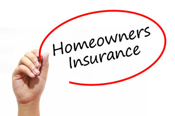 Man Hand writing Homeowners Insurance with marker on transparent wipe board. Business, internet, technology concept.