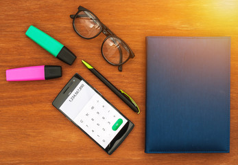 top view of office desk withsmart phone