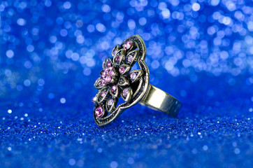 Jewellery ring against blue background
