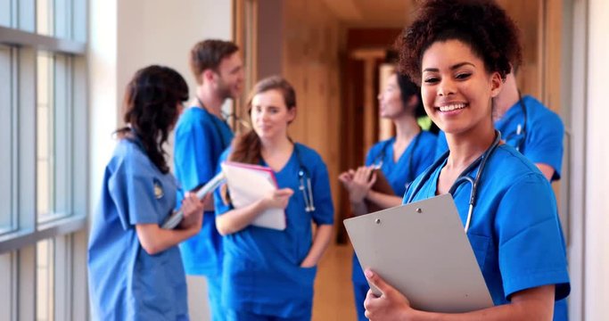 Medical students chatting in hallway in high quality 4k format
