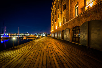 Naklejka na ściany i meble Henderson's Wharf at night, in Fells Point, Baltimore, Maryland.
