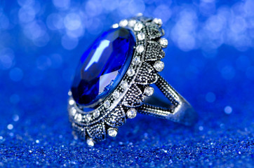 Jewellery ring against blue background