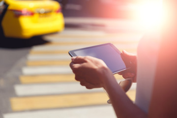 Female hands closeup holding sunglasses and tablet