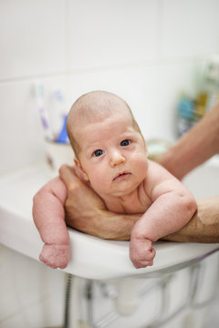 Finland, Portrait of baby boy (2-5 months) in sink