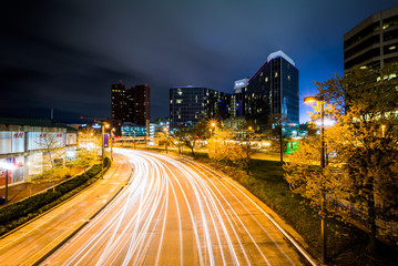 Long exposure of buildings and traffic on Light Street at night,