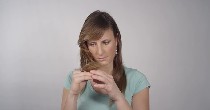 Woman looking at her splitted ends