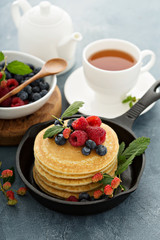 Fluffy buttermilk pancakes with fresh berries