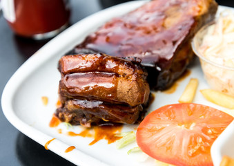 juicy grilled pork leg with fresh salad