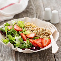 Quinoa salad with strawberries and greens