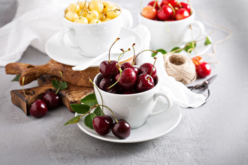 Fresh sweet cherries in cups
