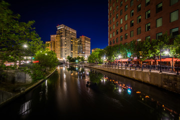 Fototapeta na wymiar Modern buildings and the Providence River at night, in downtown