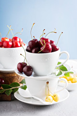 Fresh sweet cherries in cups