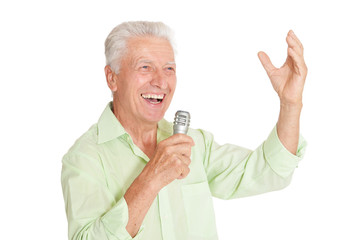 Senior man  singing into microphone 