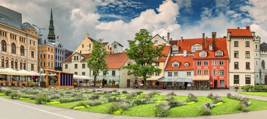 Panoramic view on flowered Livu square in the center of old Riga with numerous coffee shops and restaurants, Latvia
