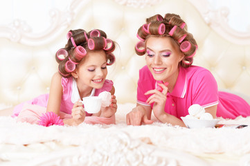  Mother and daughter in hair curlers
