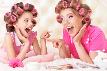  Mother and daughter in hair curlers