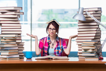 Young female student preparing for exams