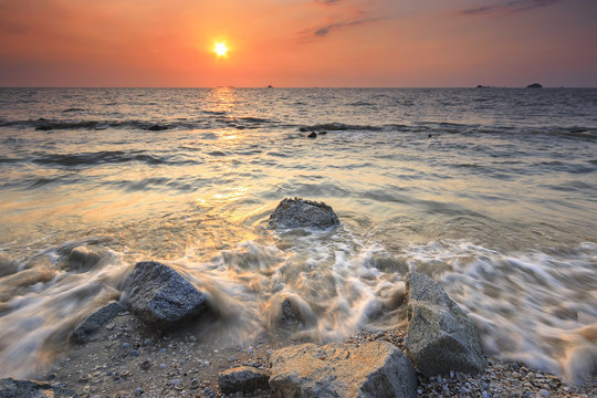 Beach with beautiful warm sunset