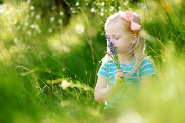 Portrait of cute little cheerful girl outdoors