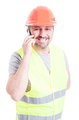 Successful engineer smiling and talking on cellphone