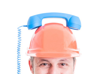 Closeup of builder holding retro receiver on helmet