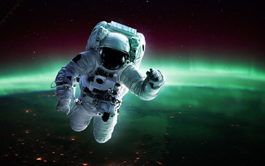 Fototapeta na wymiar Astronaut in outer space. Spacewalk. Elements of this image furnished by NASA