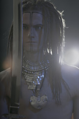 Young man's portrait. Stylish handsome sexy Guy with Dreadlocks