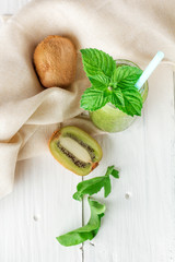 Fototapeta na wymiar Fruit and vegetable smoothies out of kiwi, arugula